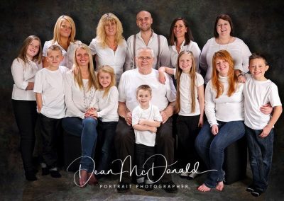 Family Portrait of 16 people. Bright and vibrant colour palette.