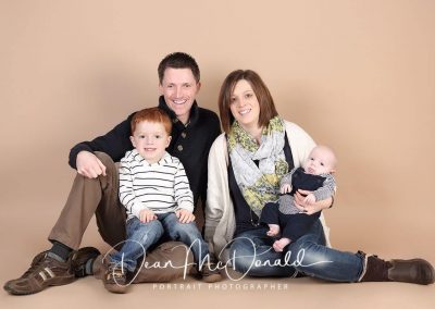 Family portrait with newborn baby and child.