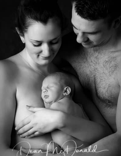 Intimate family portrait with newborn.