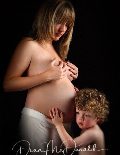 Maternity Portrait of a child listening to his mother's