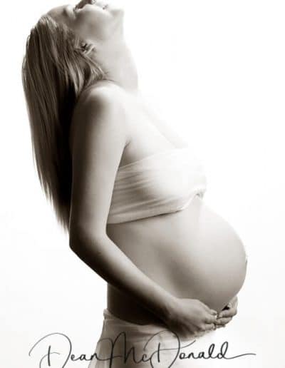 Pregnant woman in artistic pose.