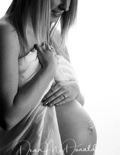 Pregnant woman in artistic pose.