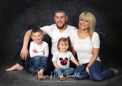 Family Portrait in white matching outfits.