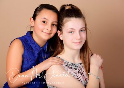 Loving sister portrait that evokes warmth and connection.