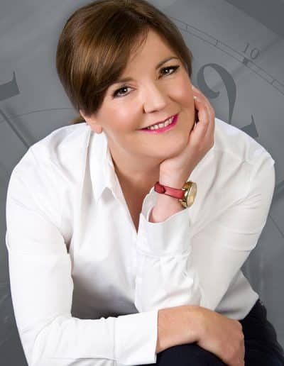 Person in white shirt, thoughtful pose. Clock, Time, Portrait background | Dean McDonald Photography.