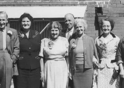 Group photo in vintage attire. Photo Restoration