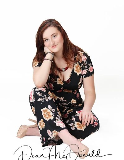 A young teenager in stylish outfit model posing elegantly.