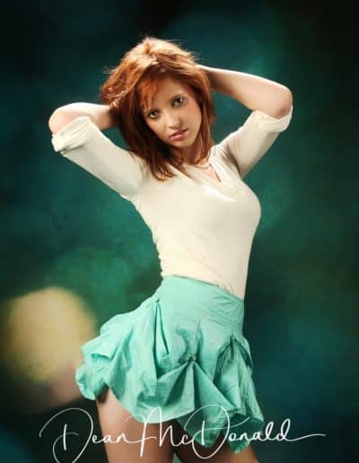 A young teenager in stylish outfit model posing elegantly.