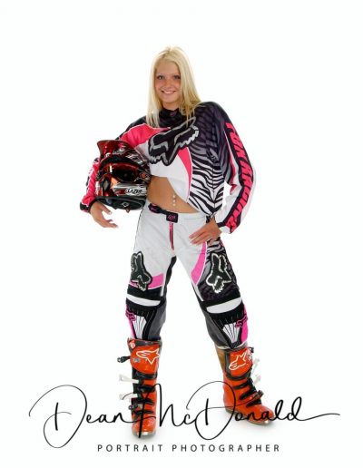 Motocross rider in vibrant gear.