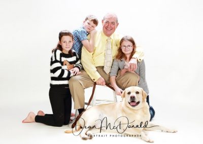 Family portrait with a Labrador dog.