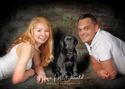 Family Pet Portrait with a black labrador puppy.