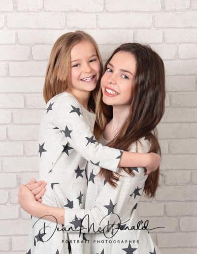Siblings in matching outfits.