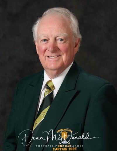 Man in green blazer and tie. Golf cptain Portrait.