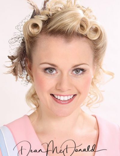 Elegant hairstyle with 1950's vintage flair. Headshot Portrait.
