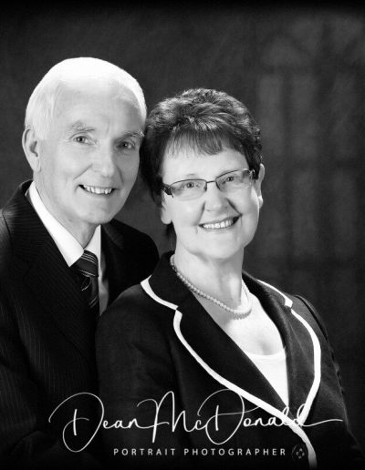Formal couple portrait in black and white.