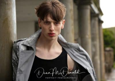 Stylish individual in urban setting.