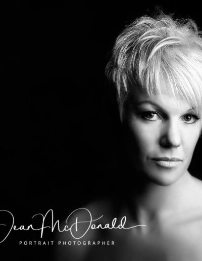 Monochrome portrait of a woman with light hair.
